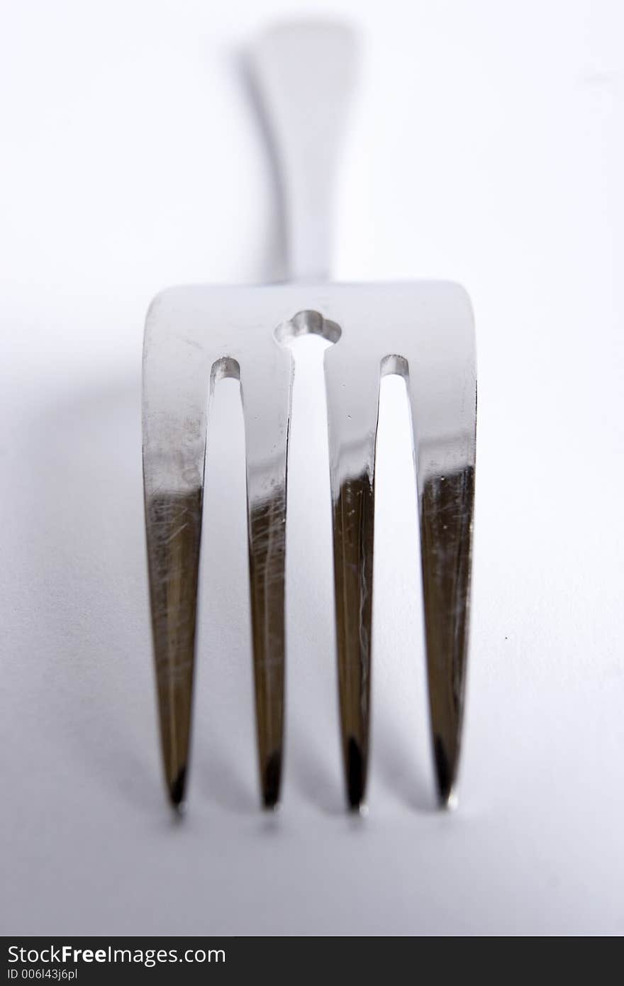 A single fork on a white background. A single fork on a white background