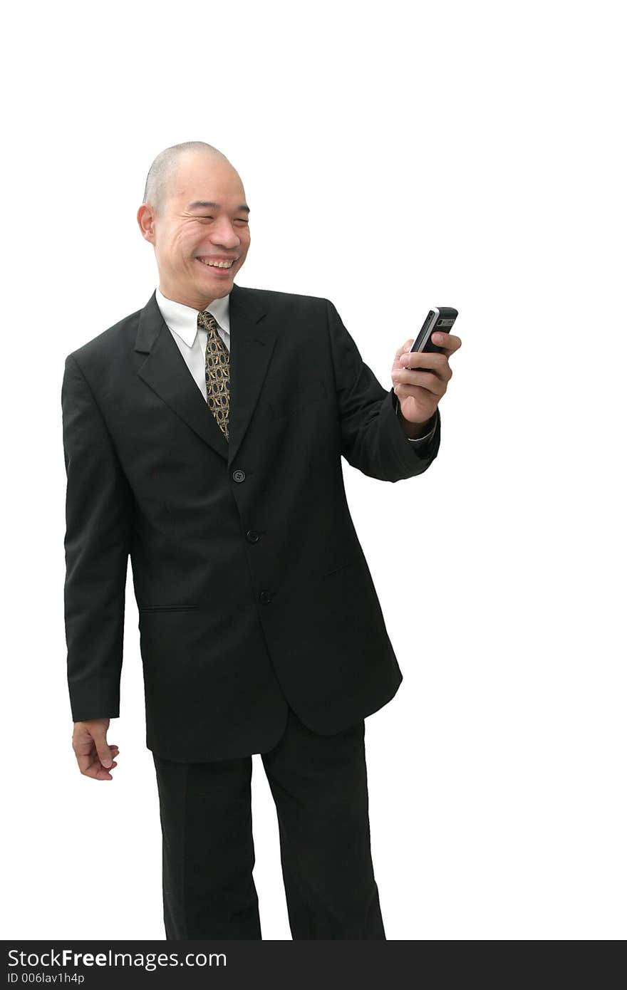 Oriental man in suit on cell phone looking happy. Oriental man in suit on cell phone looking happy