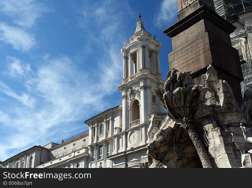 This is a less-conventional shot of Piazza Navonna in Rome, Italy: the Fountain of the Four Rivers is on the right-hand side of the photo, but we look past it to the often-overlooked church that shares the Piazza.