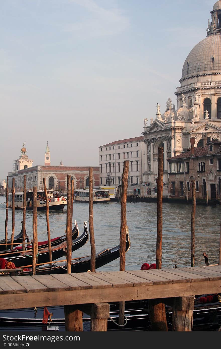 This is all of Venice encapsulated into one image: the church that lies at the mouth of the Grand Canal, bathed in late-day sun, while gondolas lined up at the water's edge seem to pay homage to it. This is all of Venice encapsulated into one image: the church that lies at the mouth of the Grand Canal, bathed in late-day sun, while gondolas lined up at the water's edge seem to pay homage to it.