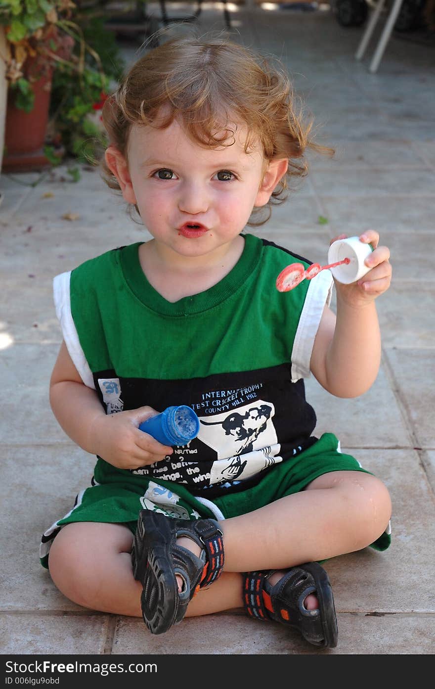 Cute child tring to blow soap. Cute child tring to blow soap