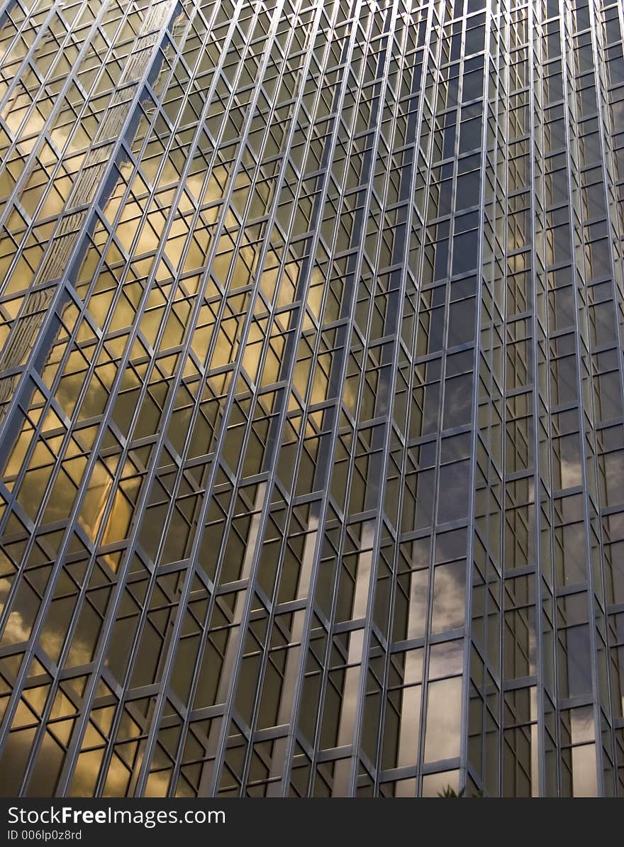 Unique patterns from gold plated glass windows of an office building