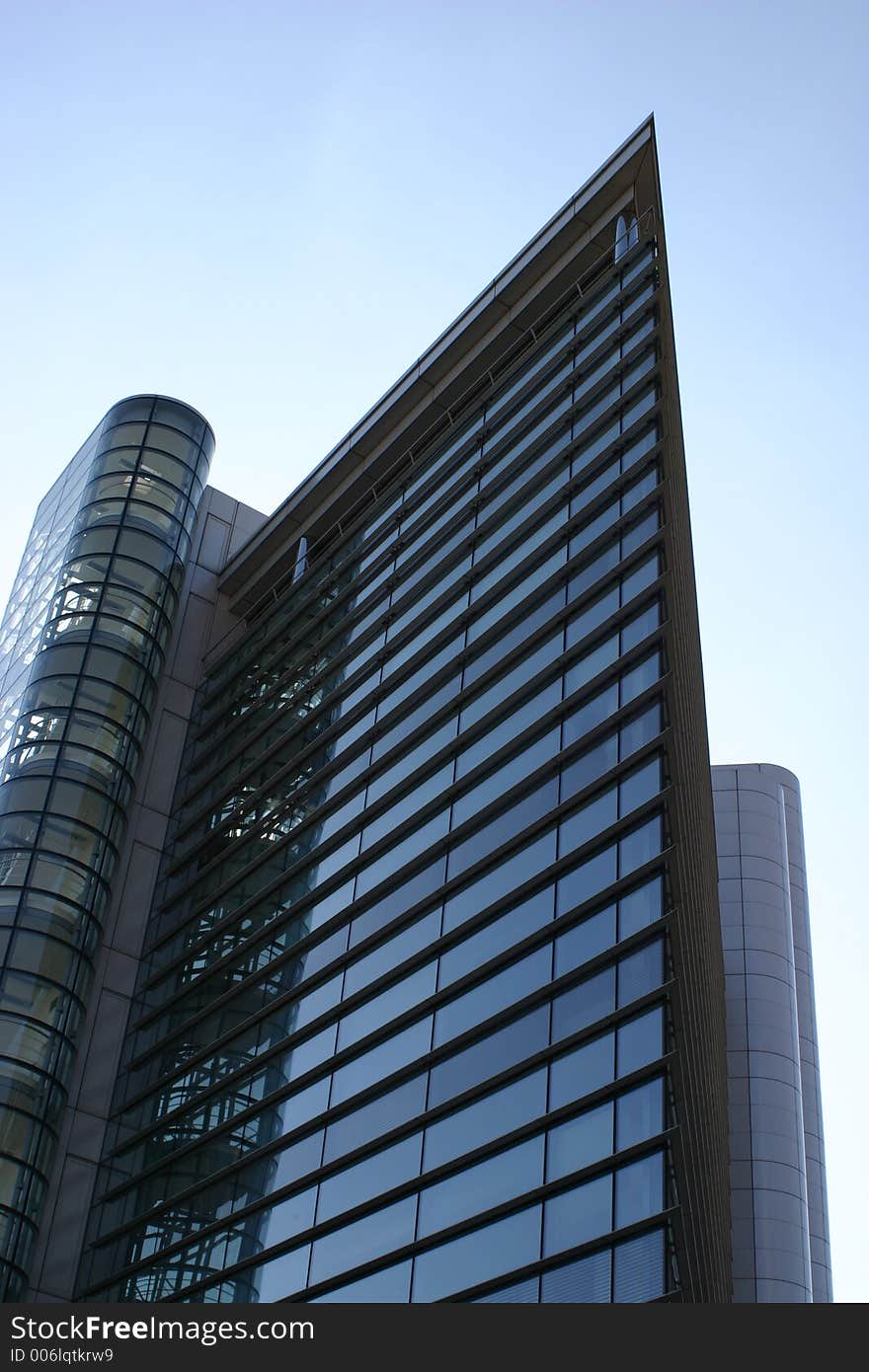 Steel and glass office block, with one sign, Leeds, West Yorkshire, England. Steel and glass office block, with one sign, Leeds, West Yorkshire, England