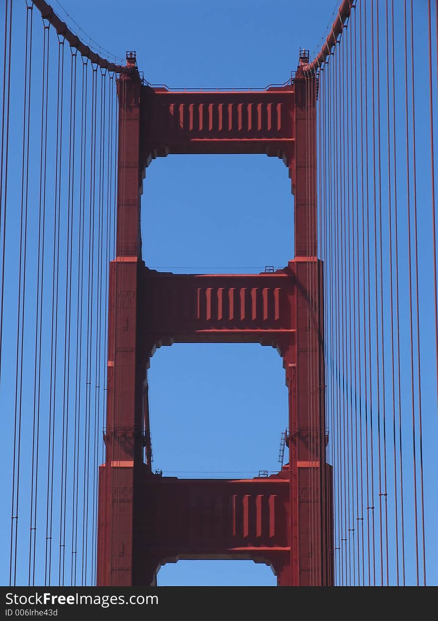 View of the Golden Gate Bridge Northern Tower from the deck of the bridge. View of the Golden Gate Bridge Northern Tower from the deck of the bridge.