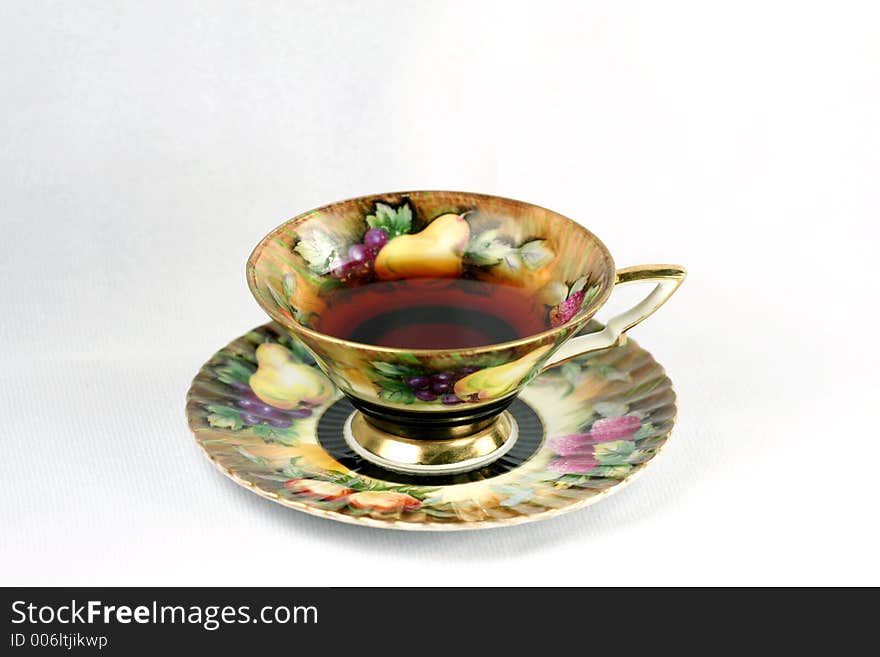 Antique teacup on white