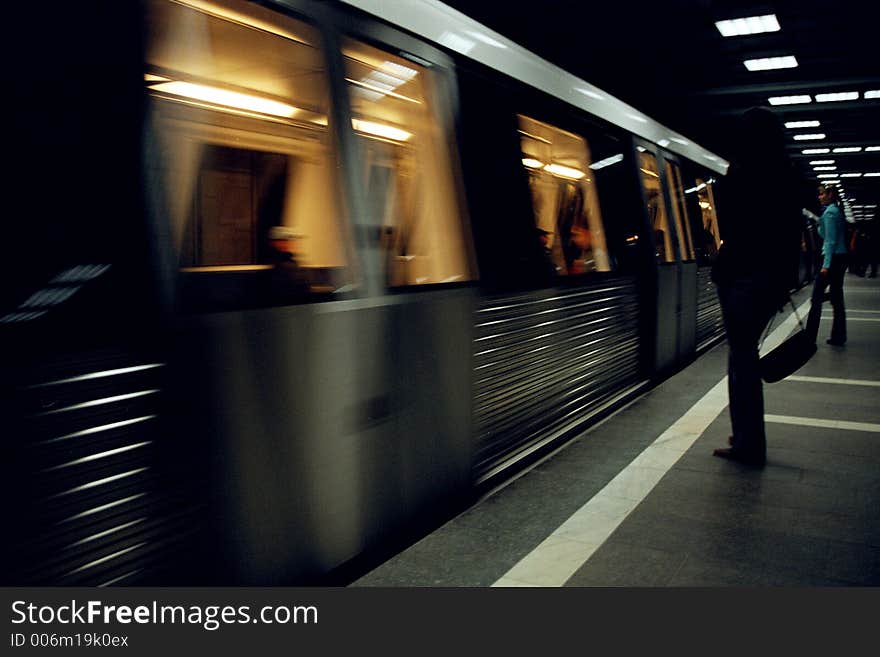 Silhouette of a girl waiting for the train to stop