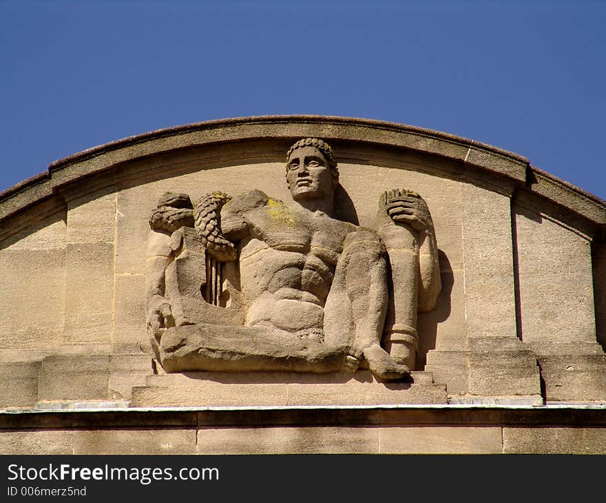 Sculpture of art-deco man on building. Sculpture of art-deco man on building