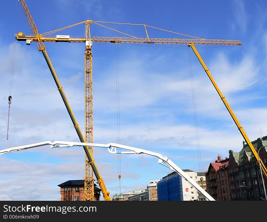 Several construction cranes