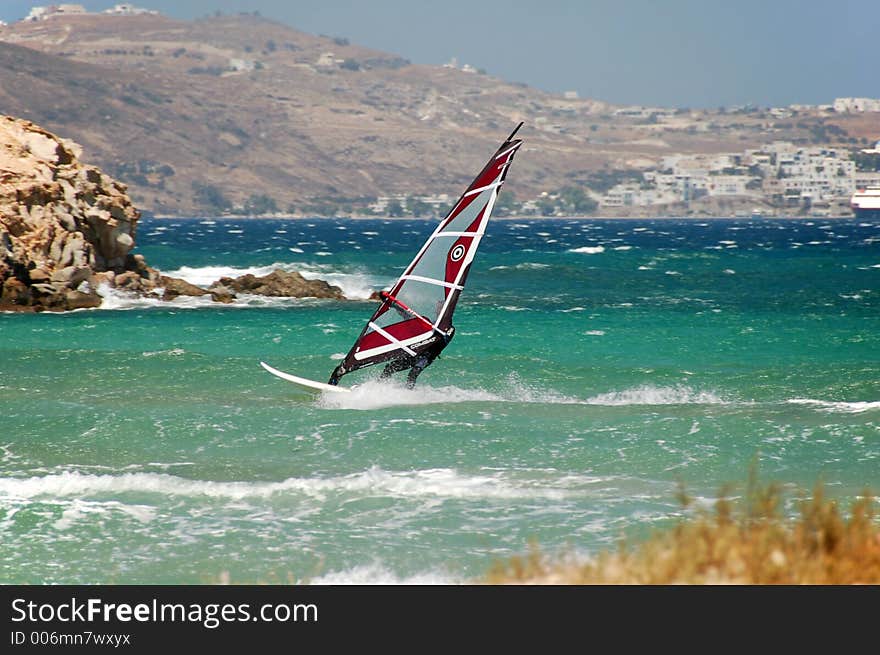 Windsurfer on rough seas in Milos Greece