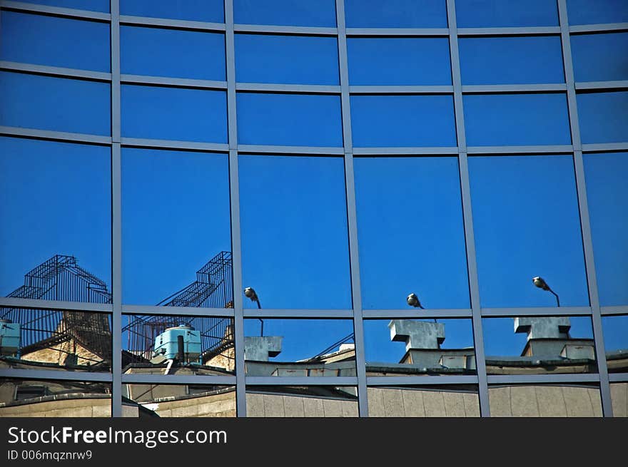 Old buildings reflected from the new. Old buildings reflected from the new