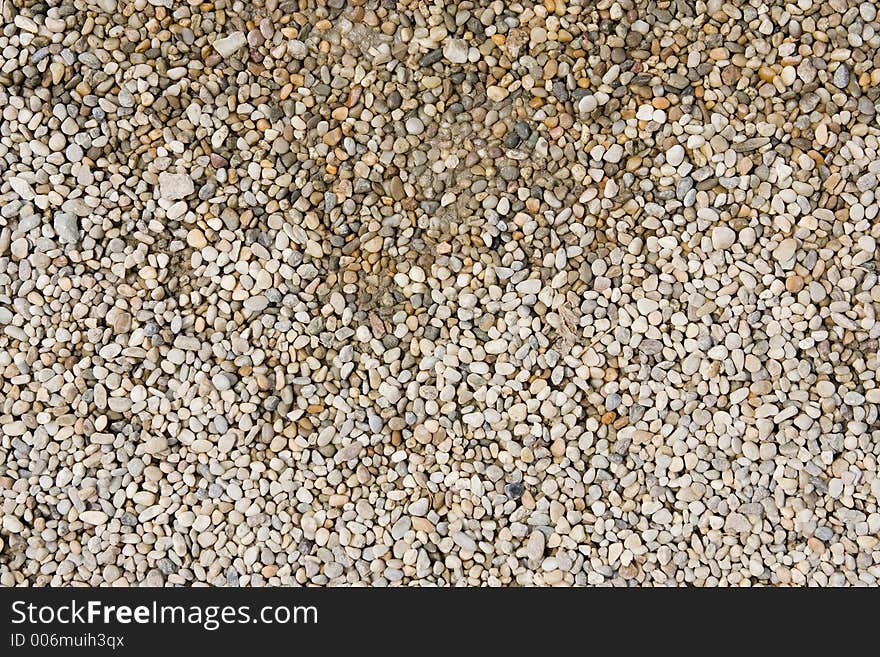 Stones on the ground, upper part is wet from water. Stones on the ground, upper part is wet from water