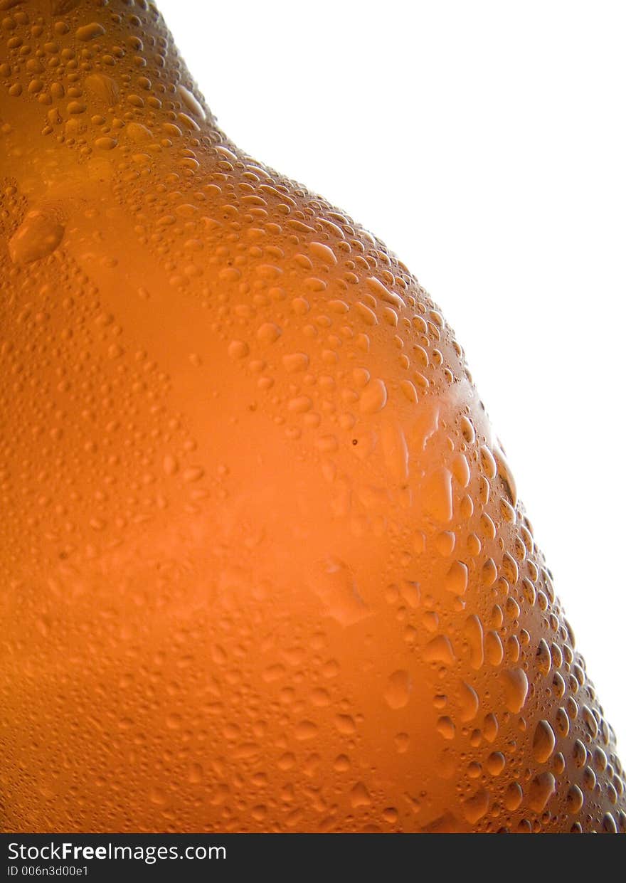 Macro of cold beer bottle with droplets