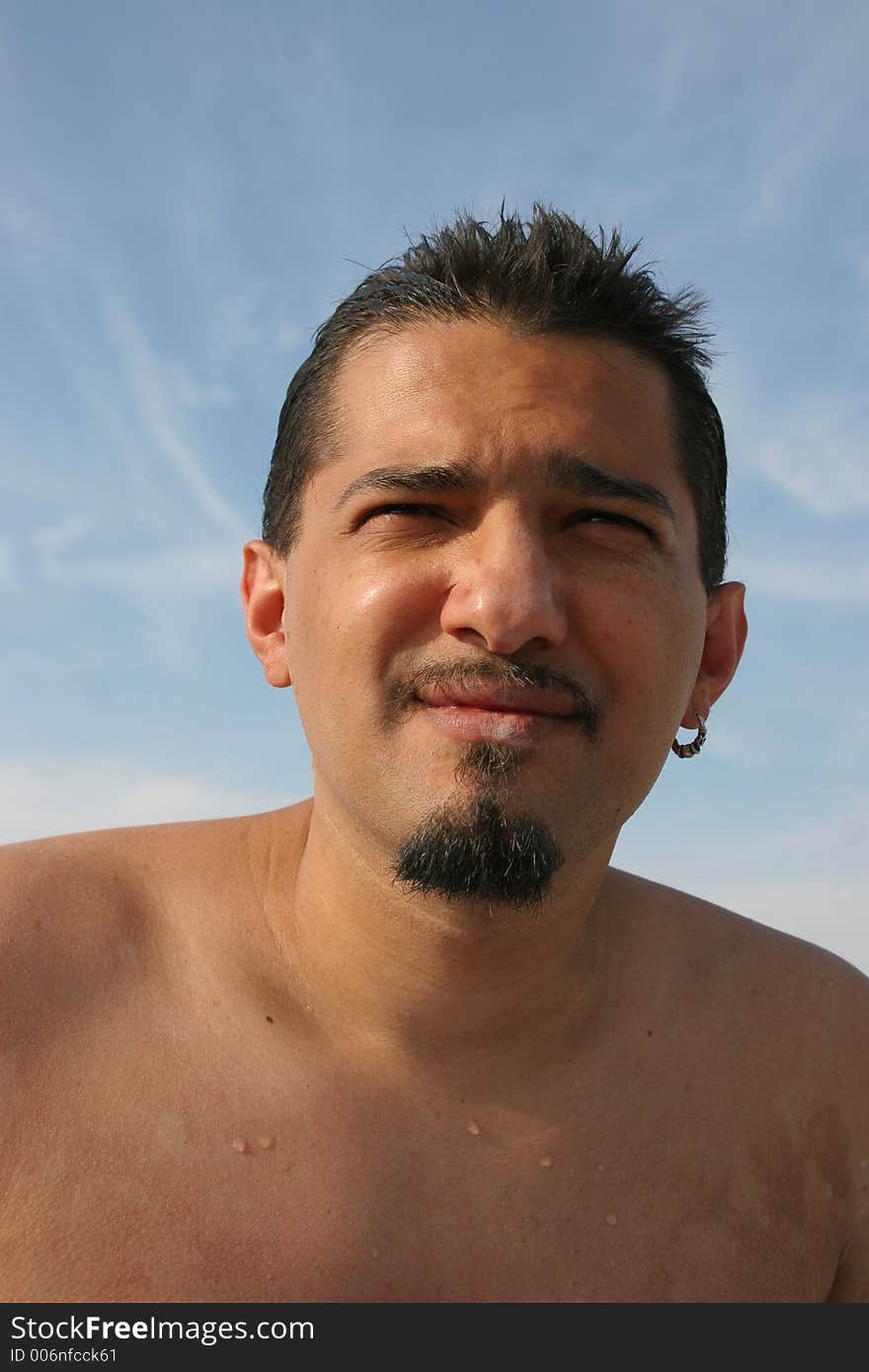 portrait of a young man on the beach. portrait of a young man on the beach