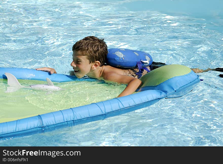 Young Boy in a Pool. Young Boy in a Pool