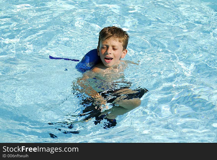 Young Boy in a Pool. Young Boy in a Pool