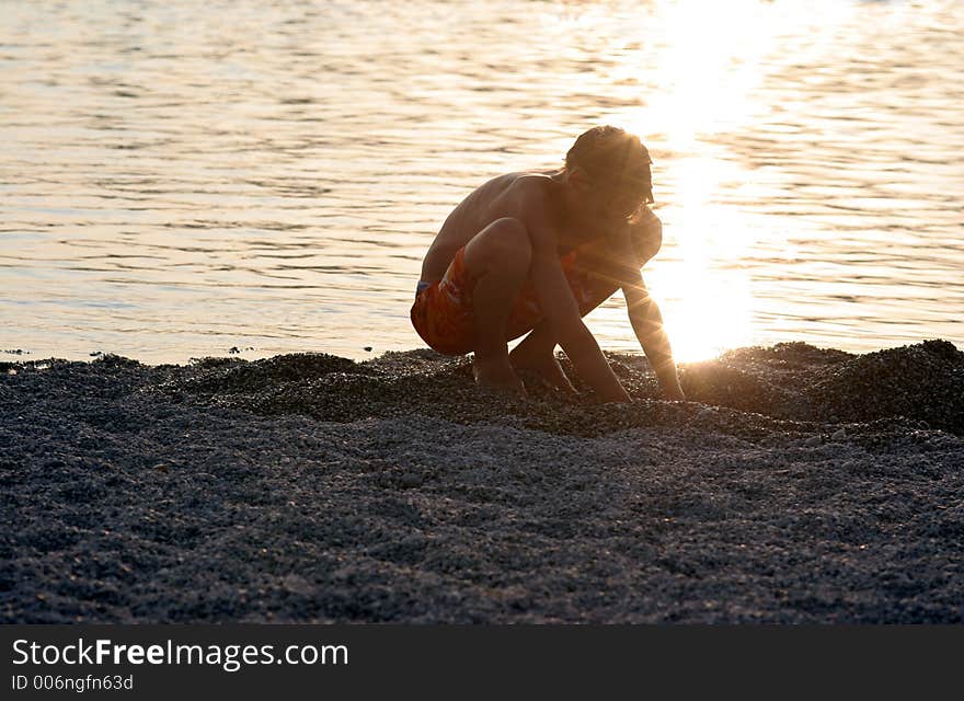 Boy playing in the sand. Boy playing in the sand