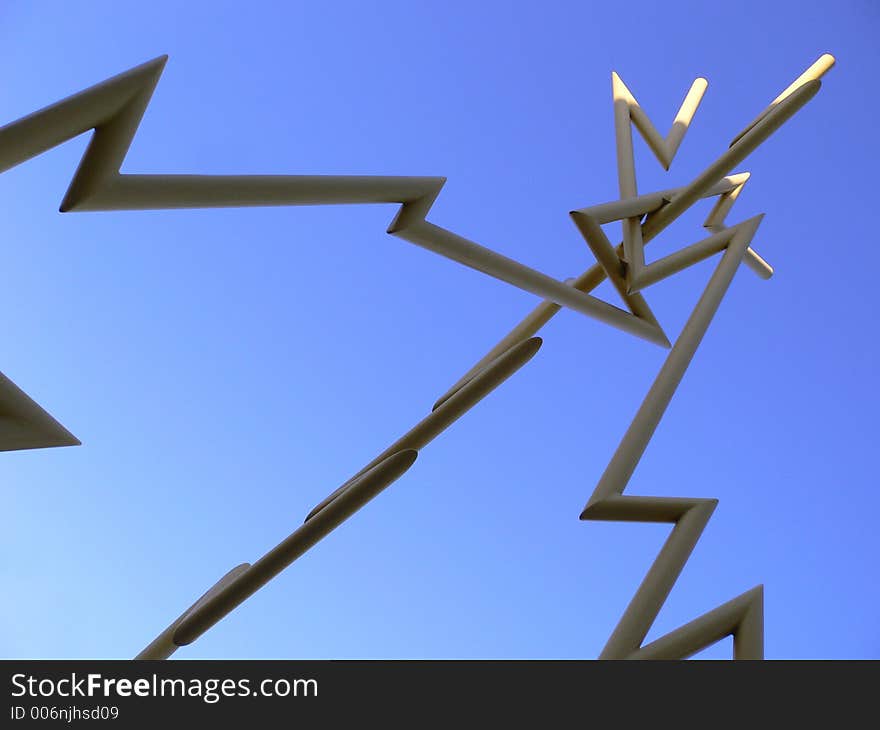 Yellow metal lightning sculpture against blue sky in channel district Tampa, Florida. Yellow metal lightning sculpture against blue sky in channel district Tampa, Florida