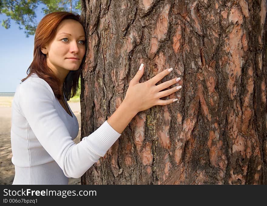 Girl on a beach in a shadow of a tree-1