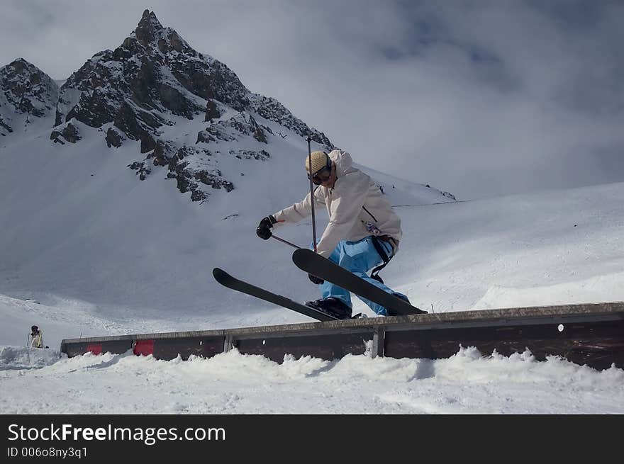 Skier sliding a rail