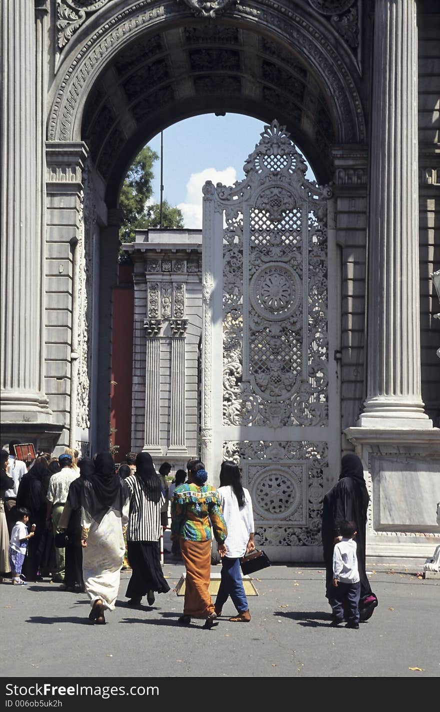 Turkish and foreign tourists entering Dolmabahce palace in Istanbul, Turkey. Turkish and foreign tourists entering Dolmabahce palace in Istanbul, Turkey