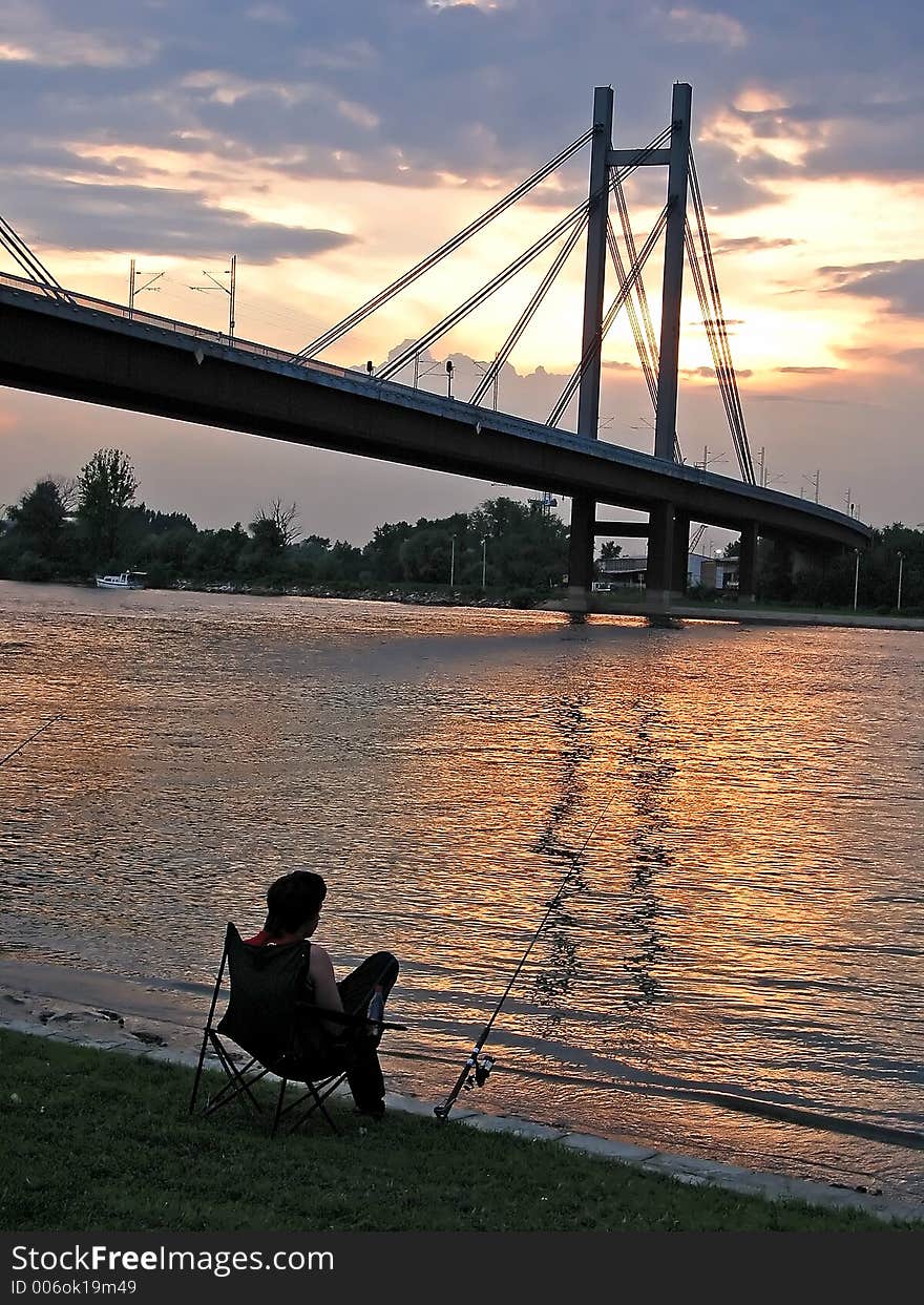 Fisherman on river bank. Fisherman on river bank