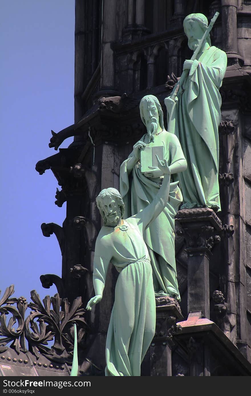 Bronze statues on a cathedral, Paris, France