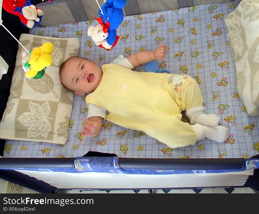 A kid lying on bed