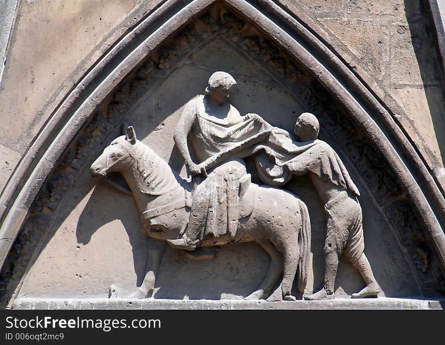 Knight fighting a peasant stone statue