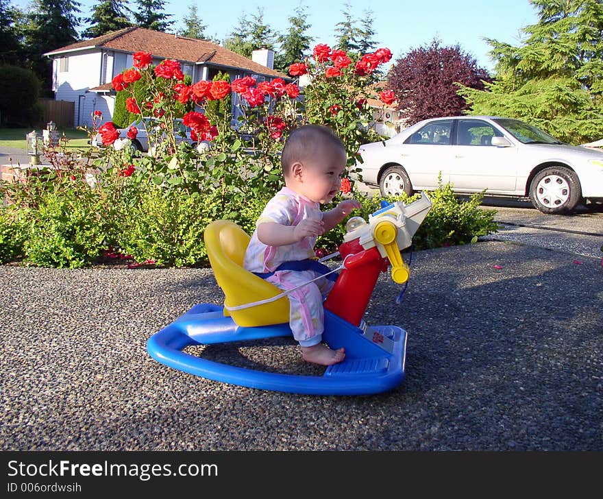 A boy is riding on a bike