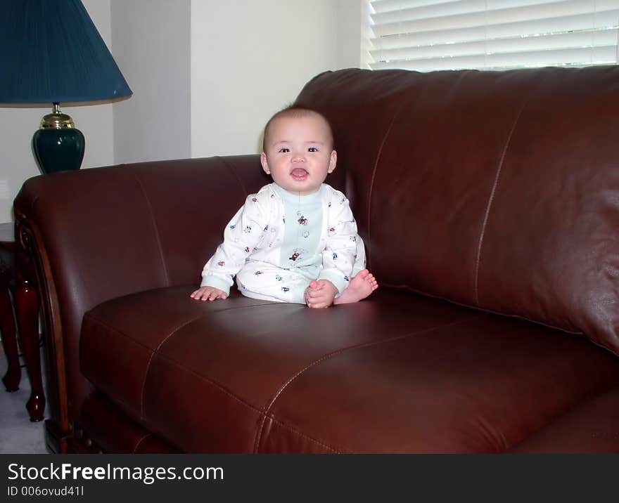 A baby on a sofa