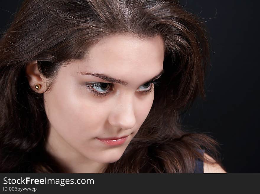 Beautiful brunette on black background