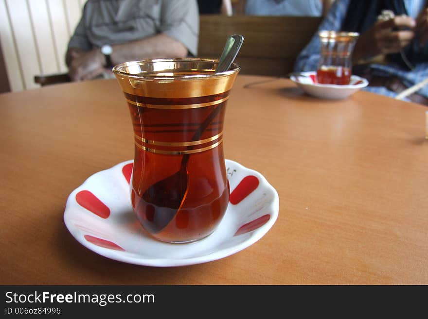 A glass of tea served with Turkish style. A glass of tea served with Turkish style