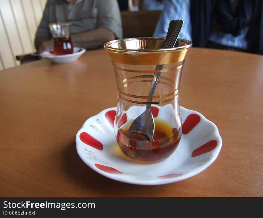 A glass of tea served with Turkish style