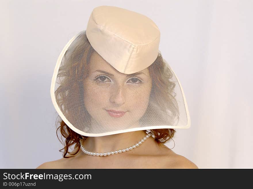 Girl in wedding hat. Girl in wedding hat