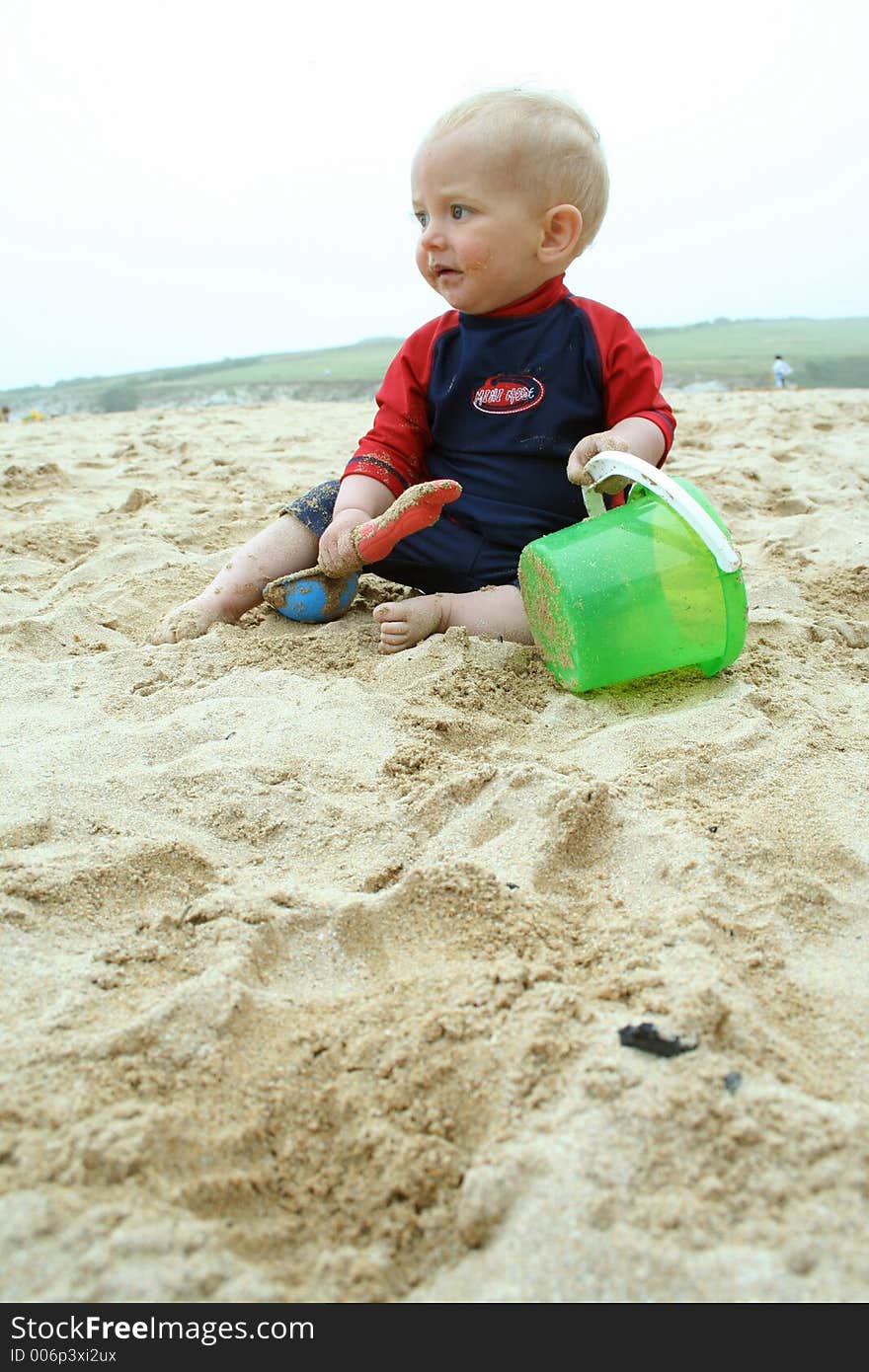 Small child exploring a beach in Cornwall. Small child exploring a beach in Cornwall.