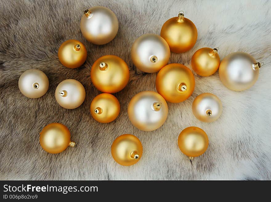 Christmas balls on reindeer fur coat