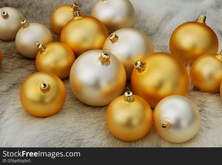 Christmas balls on reindeer fur coat