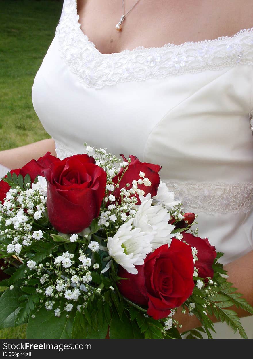 Wedding bouquet and bride s bust