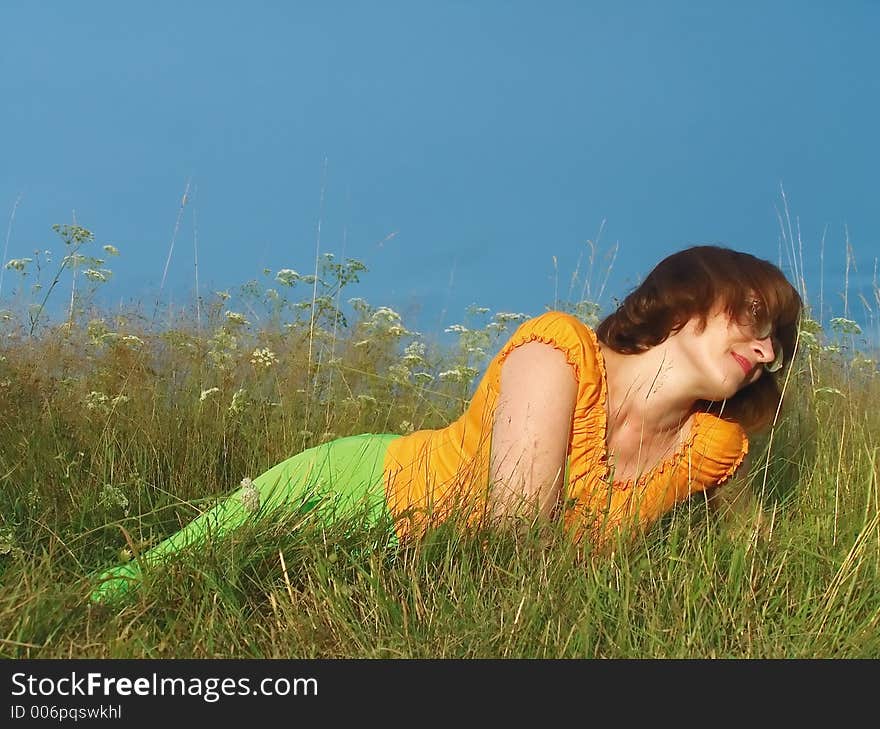 Girl reposes on grass. Girl reposes on grass