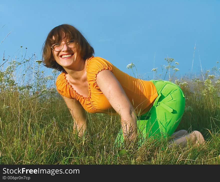 Girl Reposes On Grass