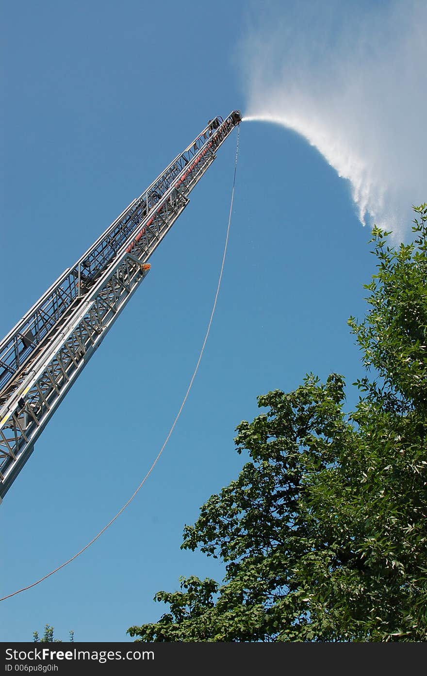 Water spray from fire truck during training exercise.