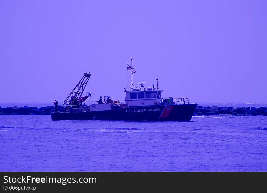 United States Coast Guard dropping channel buoys at sea. United States Coast Guard dropping channel buoys at sea.