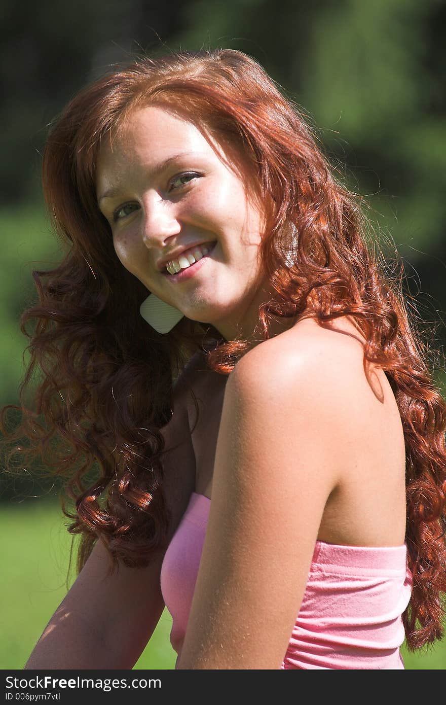 Beautiful girl in pink dress in summer day