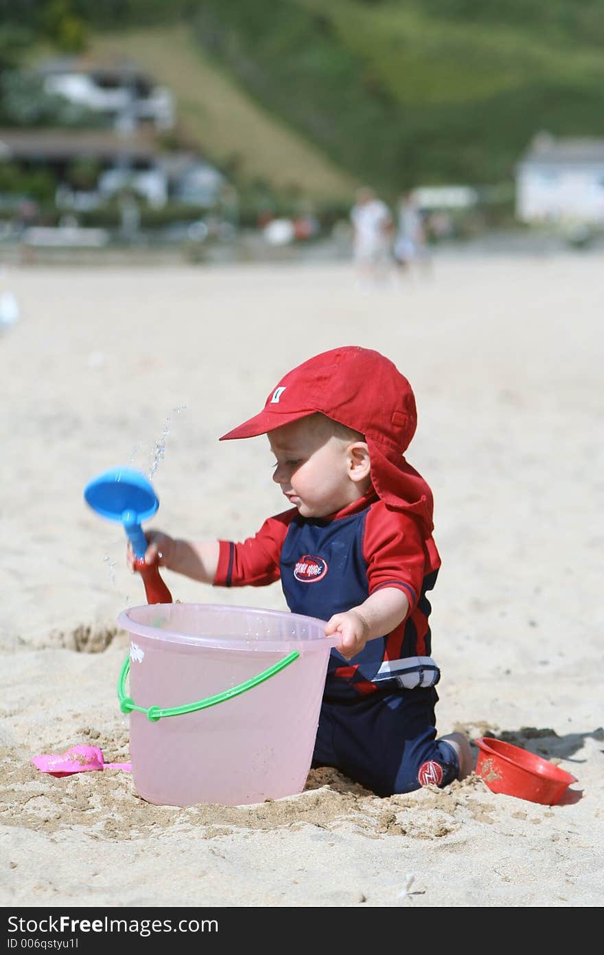 Small child exploring a beach in Cornwall. Small child exploring a beach in Cornwall.