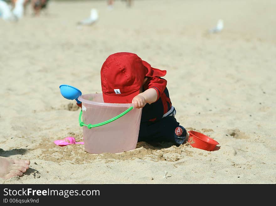 Small child exploring a beach in Cornwall. Small child exploring a beach in Cornwall.