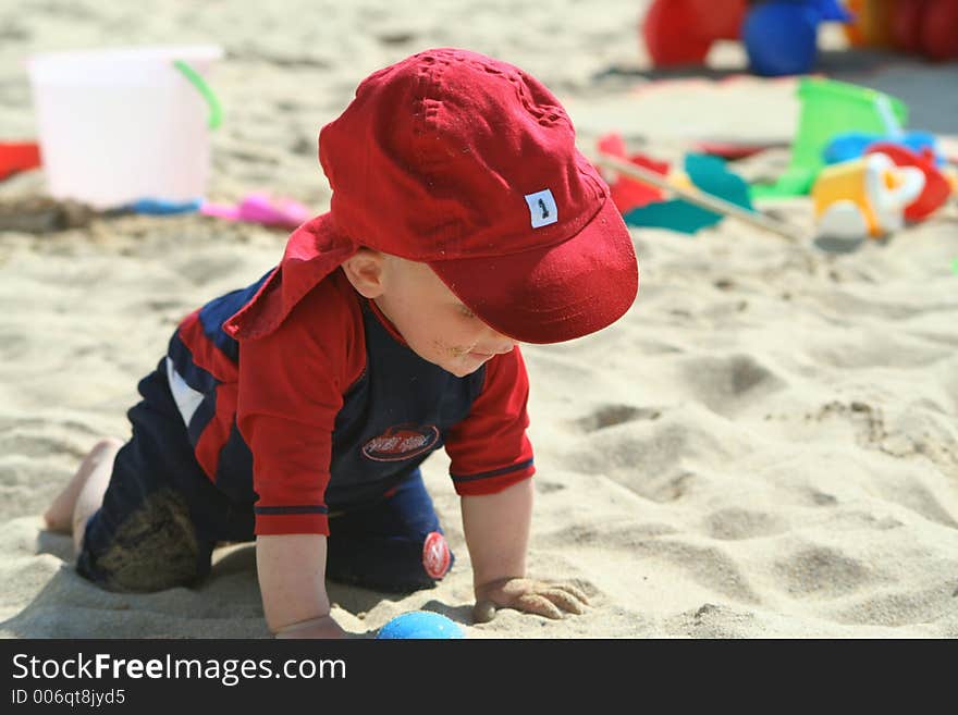 Small child exploring a beach in Cornwall. Small child exploring a beach in Cornwall.