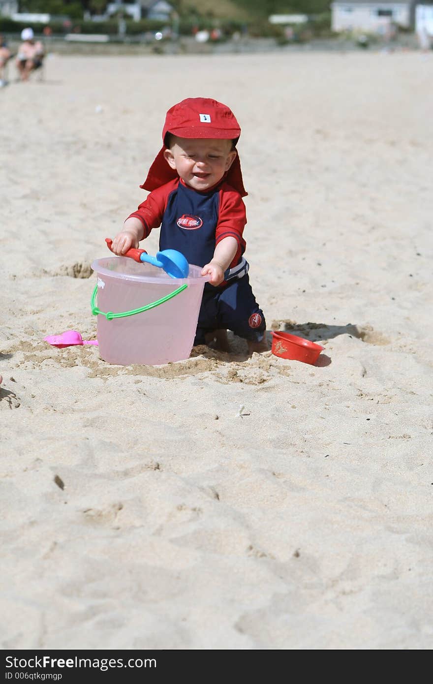 Small child exploring a beach in Cornwall. Small child exploring a beach in Cornwall.