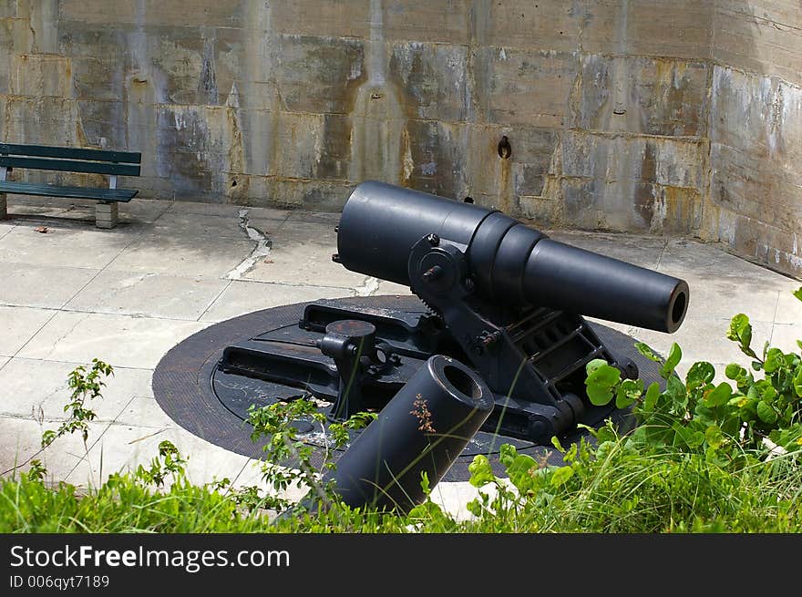 A view of the small Cannon from atop the grassy mound that covers the Ammo Bunkers. Photographed at Ft. Desoto State Park, St. Petersburg FL. A view of the small Cannon from atop the grassy mound that covers the Ammo Bunkers. Photographed at Ft. Desoto State Park, St. Petersburg FL