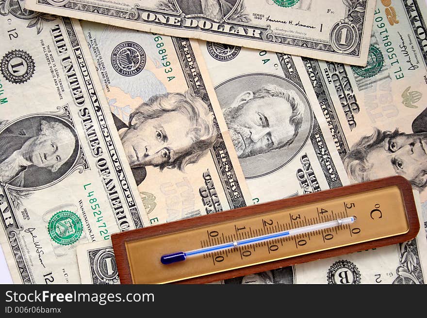 Dollars And Thermometer