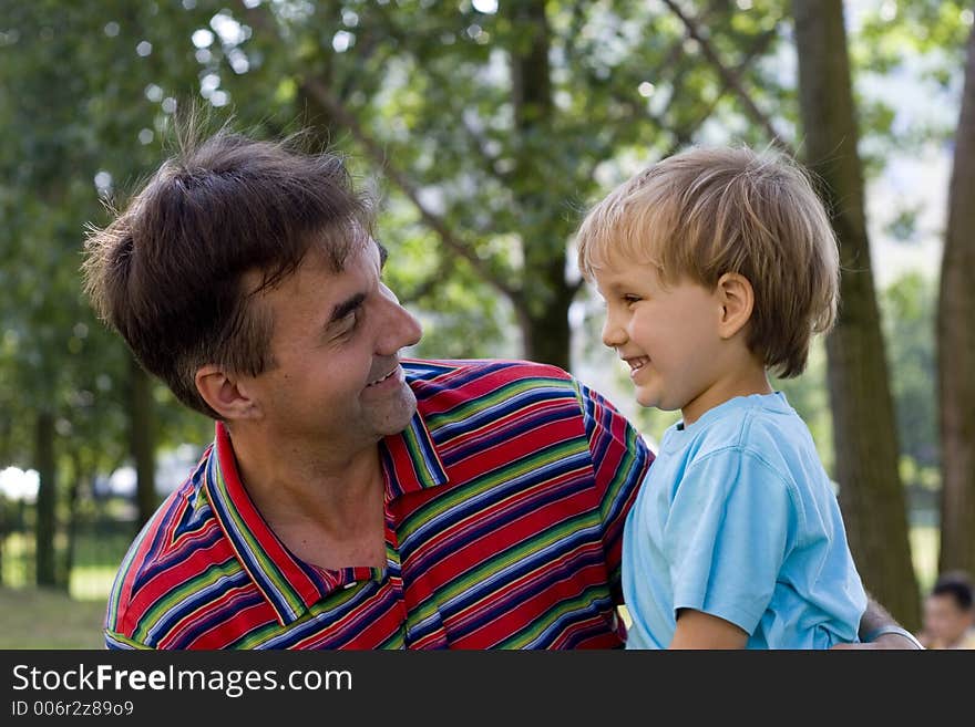 Smiling boy with uncle. Smiling boy with uncle